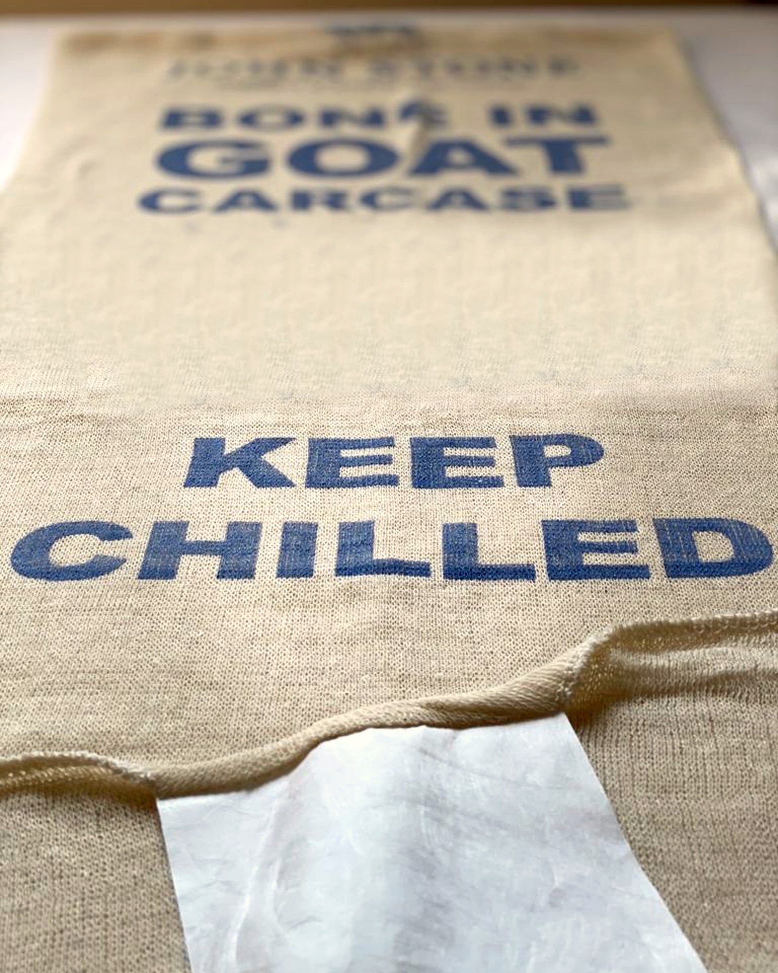 Custom printed BONE IN GOAT CARCASE KEEP CHILLED stockinette bag